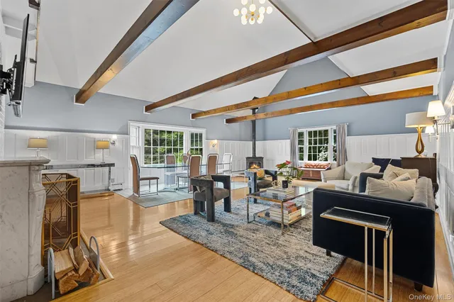 a living room with furniture and next to a large window