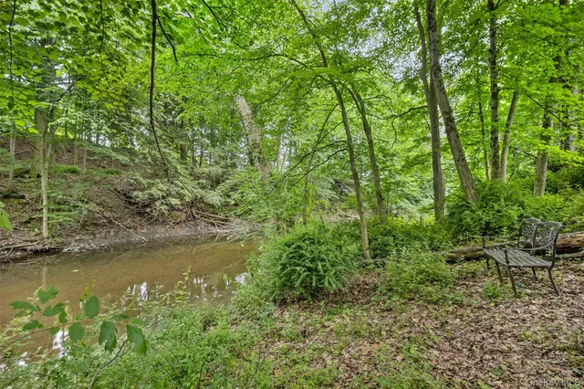 a view of lake with green space
