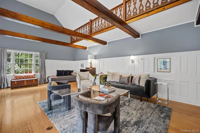 a living room with furniture a fireplace and a table