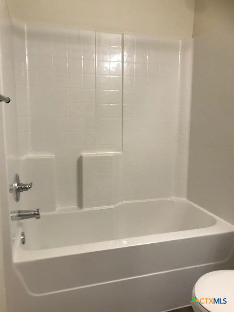 275 Olaf Drive Temple, TX 76504 - Photo 12 of 13 a bathroom with a bathtub and a shower