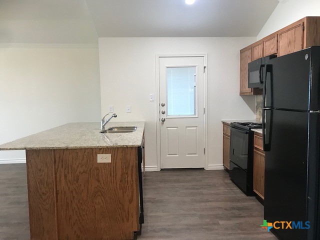 275 Olaf Drive Temple, TX 76504 - Photo 3 of 13 a kitchen with a refrigerator and a sink