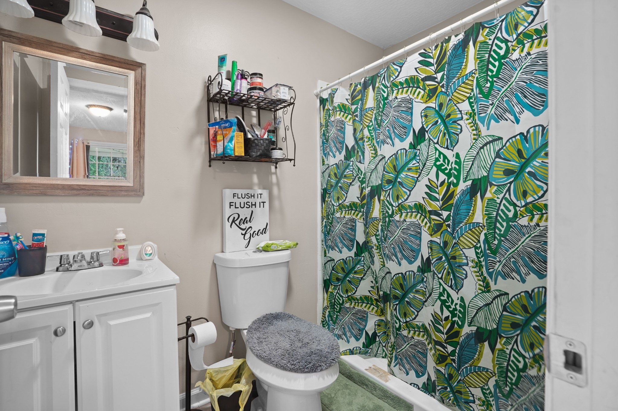 403 Victoria Street Pulaski, TN 38478 - Photo 11 of 21 a bathroom with a toilet sink and mirror