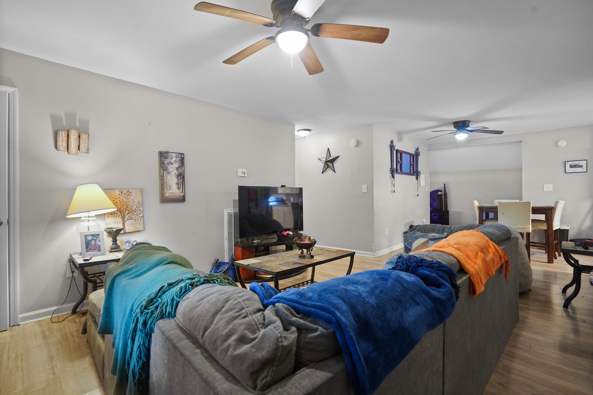 403 Victoria Street Pulaski, TN 38478 - Photo 2 of 21 a living room with furniture a ceiling fan and a window