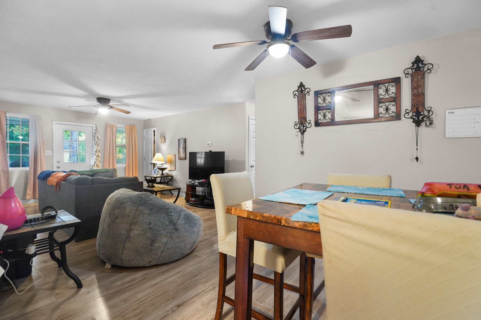 403 Victoria Street Pulaski, TN 38478 - Photo 9 of 21 a room with furniture a dining table and a chandelier