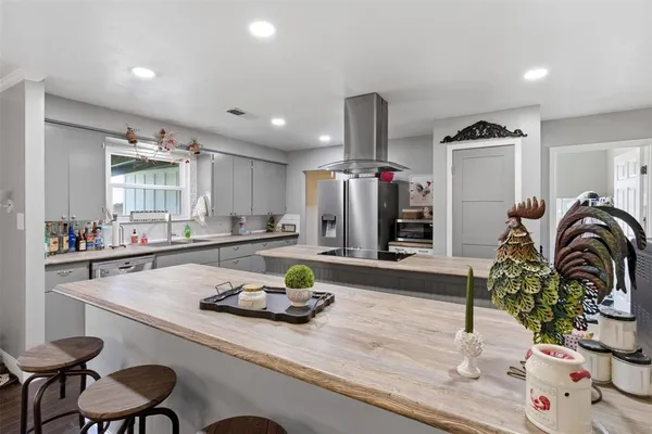 a kitchen with a table and chairs