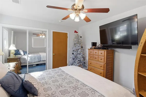 a bedroom with a bed and furniture
