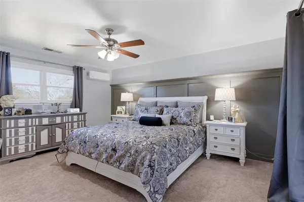 a bedroom with a bed and window