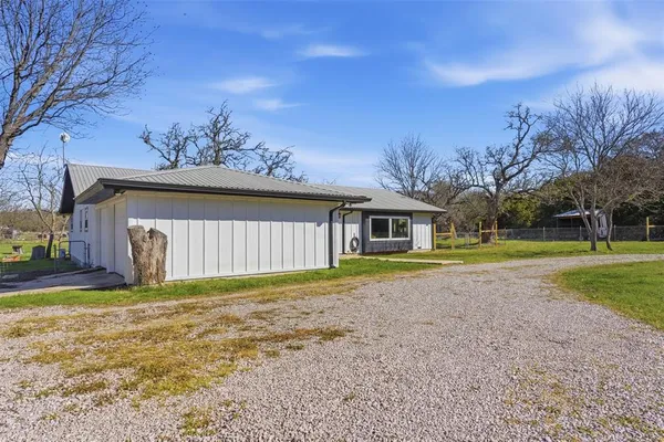 a view of a house with a big yard