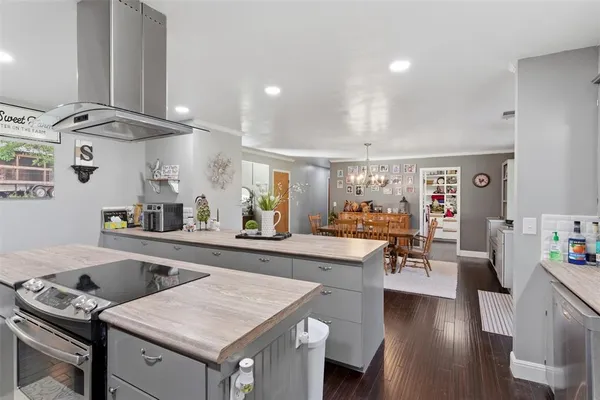 a kitchen with a table and chairs in it