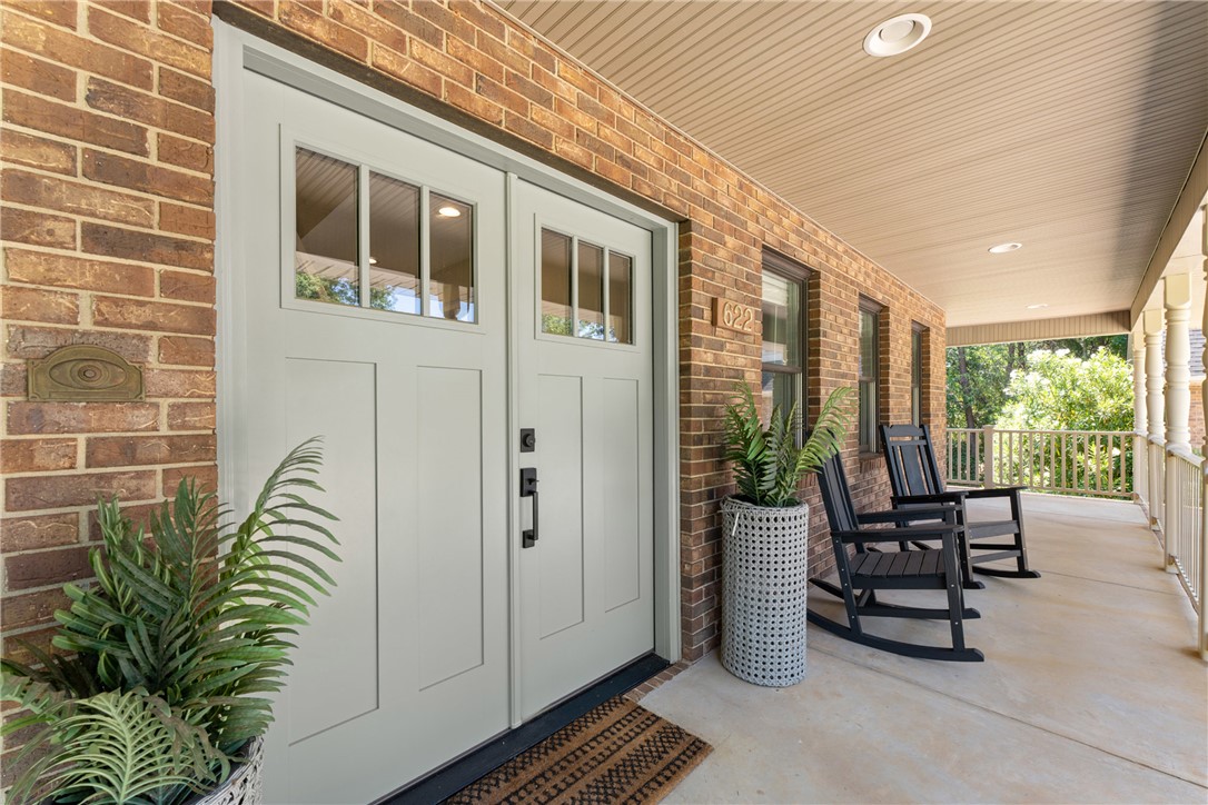 622 Jackson Road Anderson, SC 29626 - Photo 7 of 50 A welcoming brick facade with a wide, covered porch, ideal for leisurely afternoons.