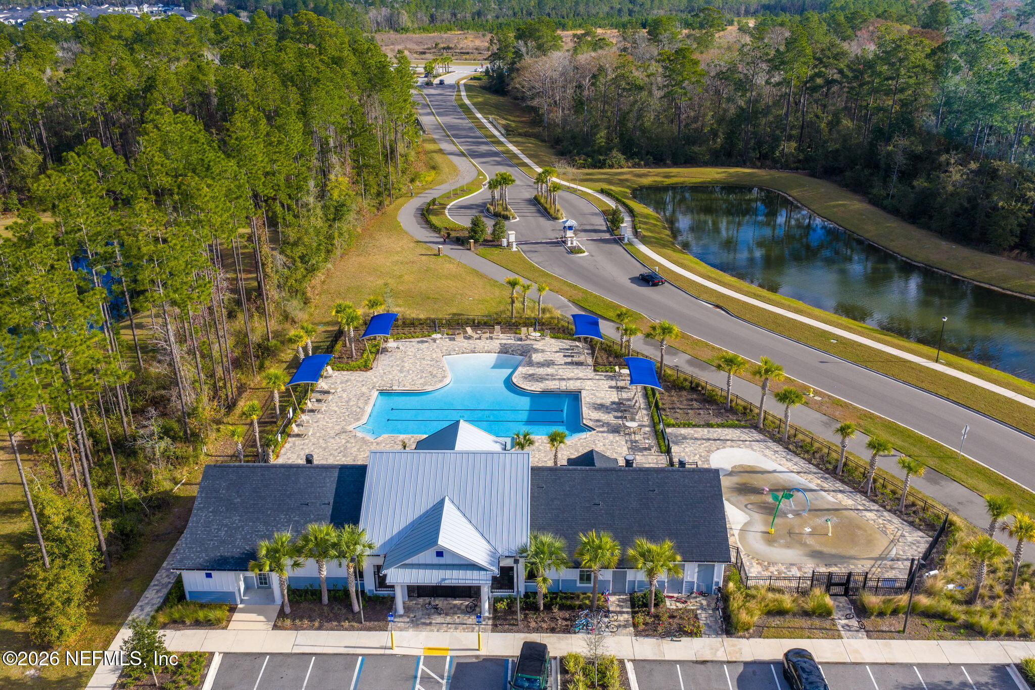 349 Coastline Way Street St. Augustine, FL 32092 - Photo 14 of 16 a view of building and yard with swimming pool