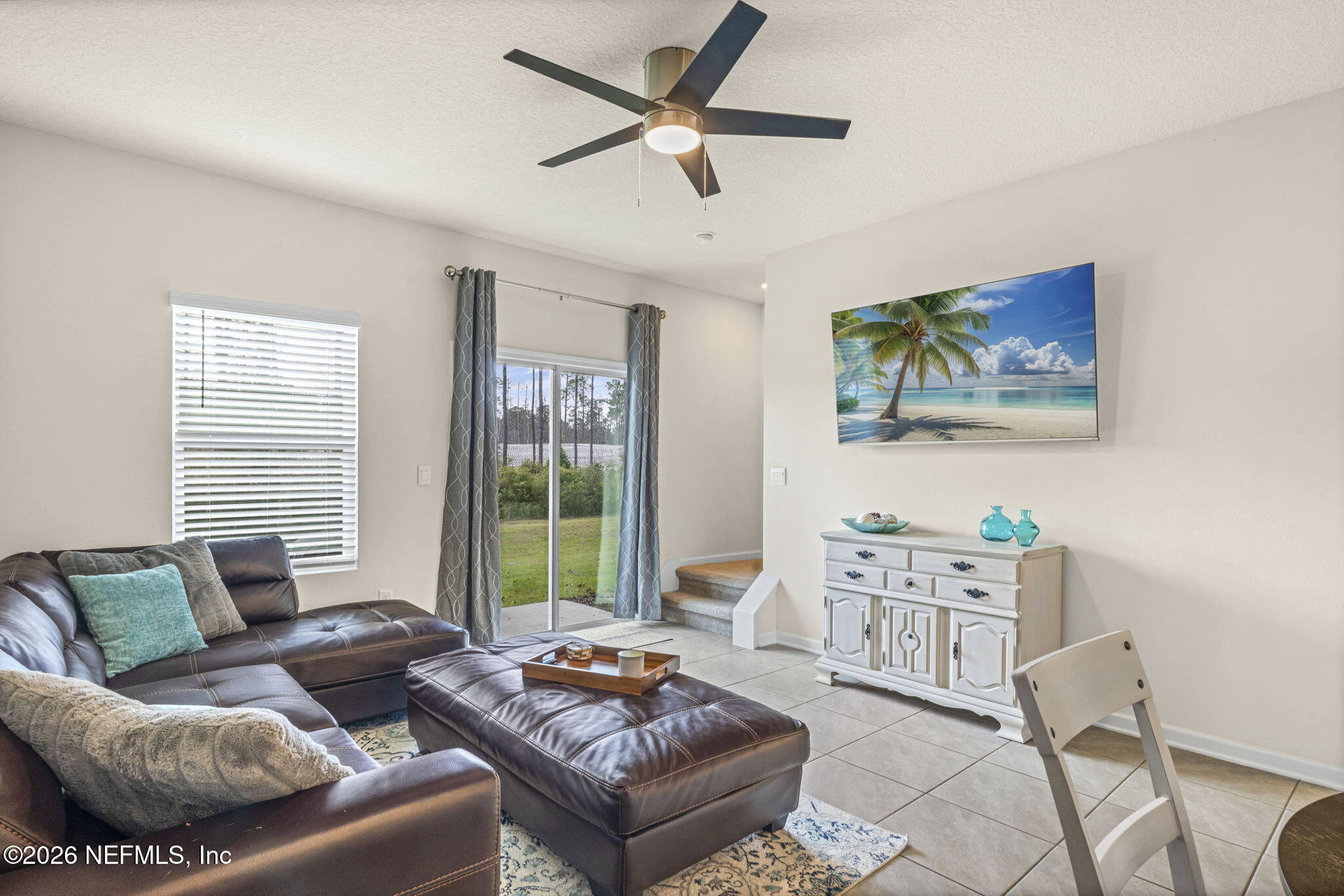 349 Coastline Way Street St. Augustine, FL 32092 - Photo 6 of 16 a living room with furniture and a large window