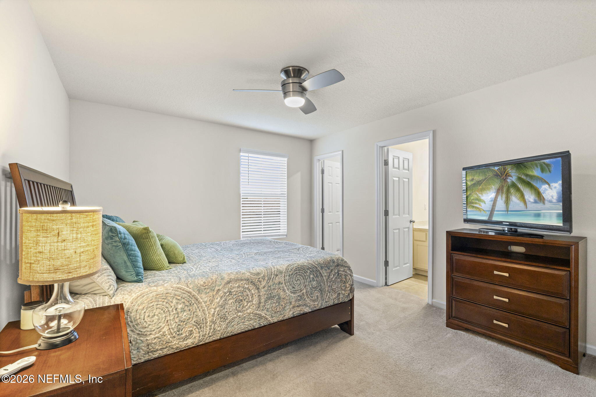 349 Coastline Way Street St. Augustine, FL 32092 - Photo 9 of 16 a bedroom with a bed and a dresser