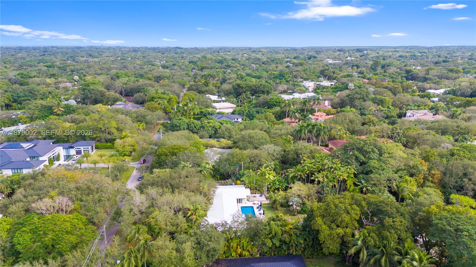 6630 Southwest 102nd Street Pinecrest, FL 33156 - Photo 4 of 4 an aerial view of residential houses with outdoor space and trees