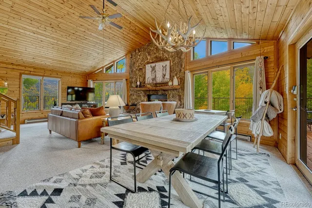 a large kitchen with a large window and stainless steel appliances