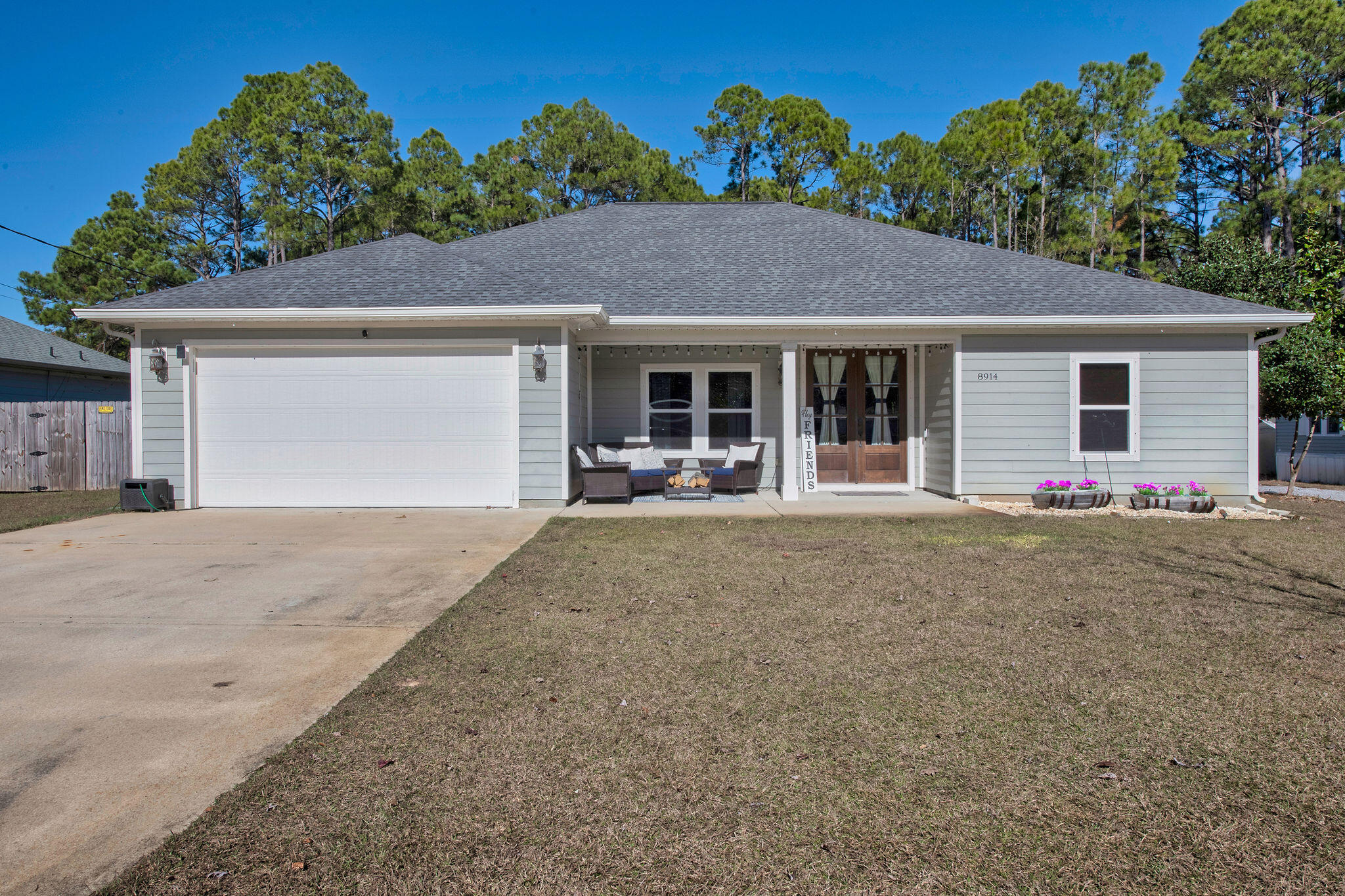 8914 Timber Lane Navarre, FL 32566 - Photo 2 of 40 front view of a house with a yard