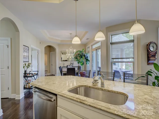 a view of a livingroom with furniture and a potted plant