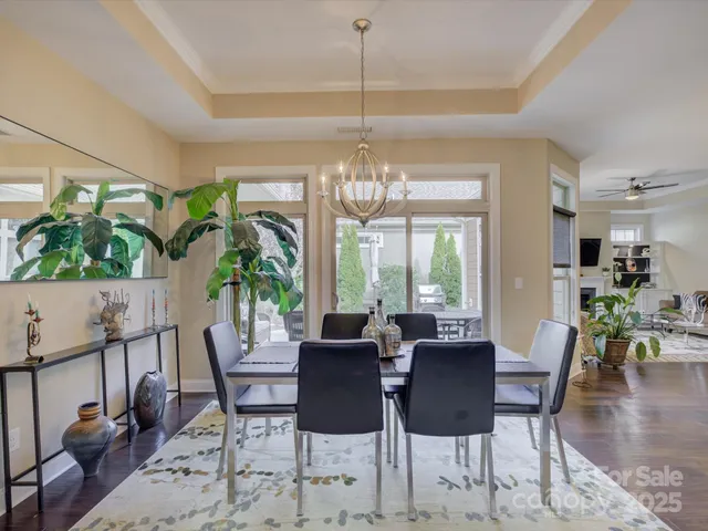 a living room with furniture a rug and a wall painting