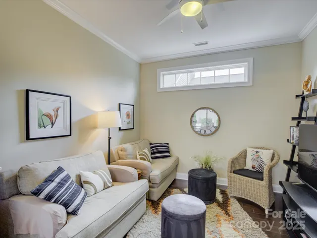 a view of a livingroom with furniture and furniture