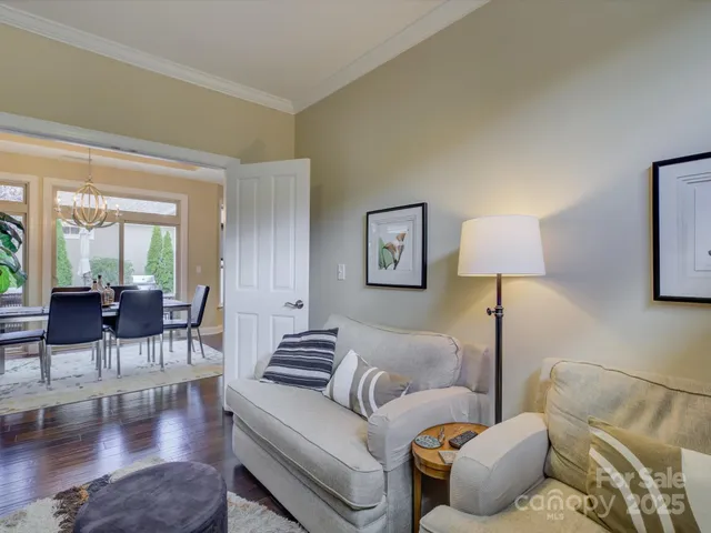 a bedroom with a bed and a refrigerator