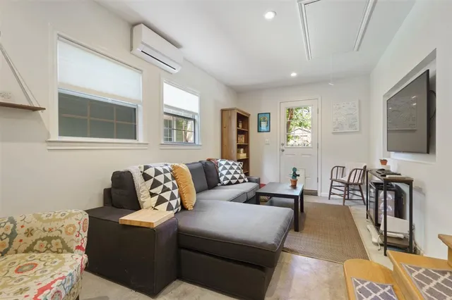 a view of a house with backyard sitting area and garden