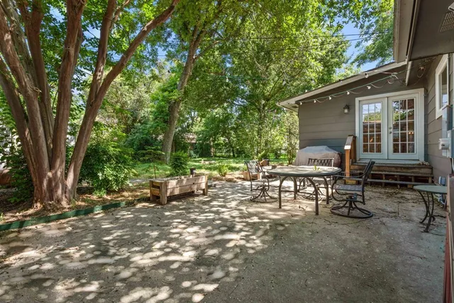 a backyard of a house with lots of green space