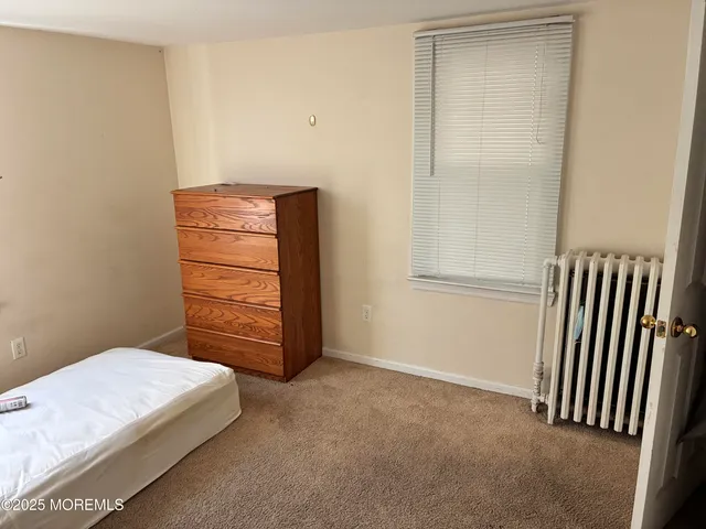 a view of room with stairs and a bathroom