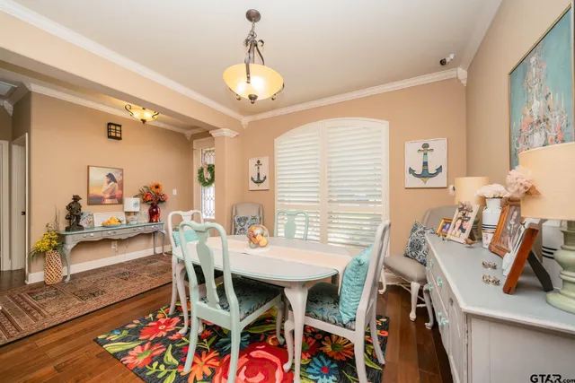 a view of a dining room with furniture and wooden floor