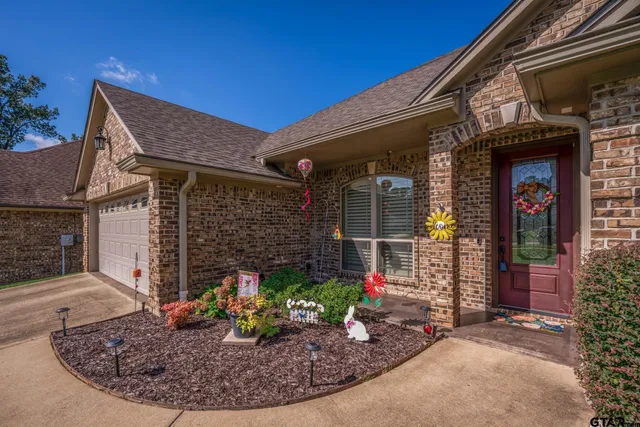 a view of a house with potted plants
