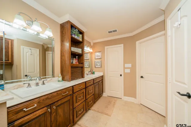 a spacious bathroom with a double vanity sink mirror and