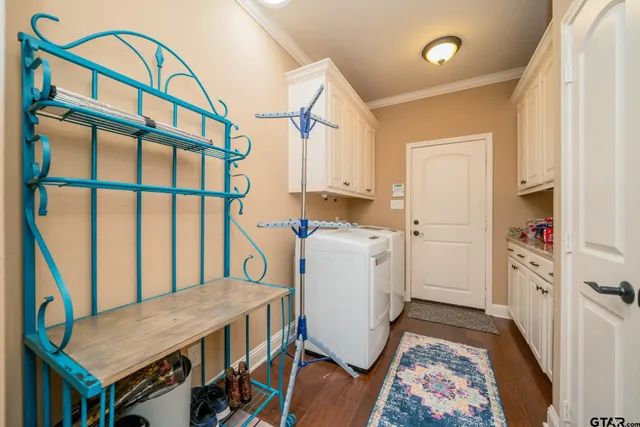 a view of a hallway with furniture and wooden floor