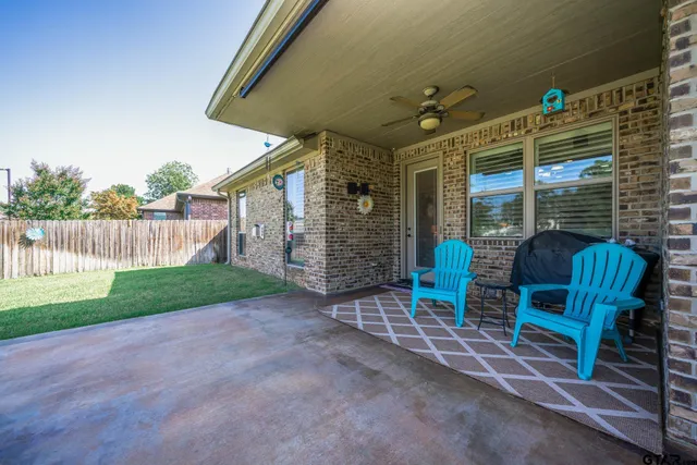 a view of a chairs with a backyard