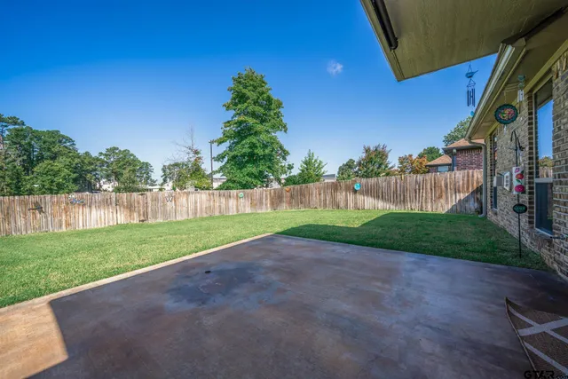a view of a yard with a street
