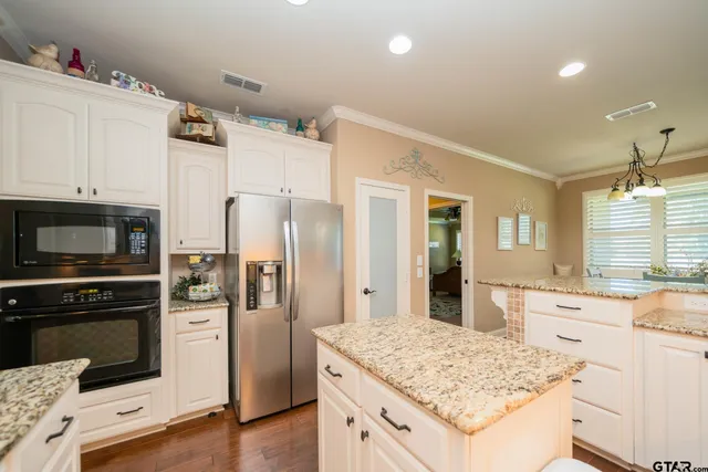 a kitchen with a sink stove and refrigerator