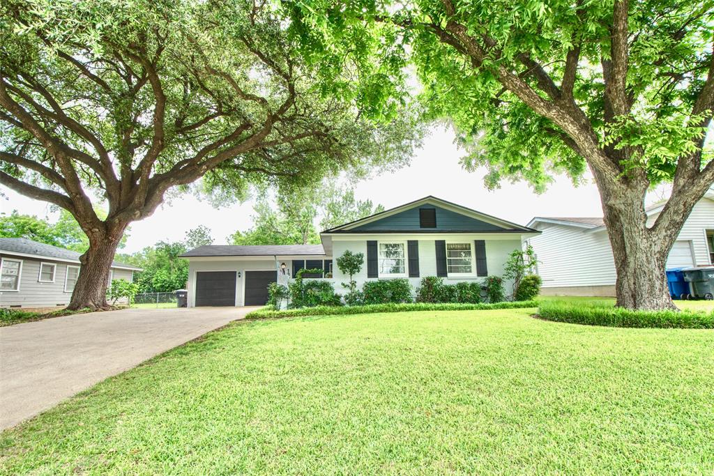 1307 North 65th Street Waco, TX 76710 - Photo 30 of 35 a front view of a house with yard and green space