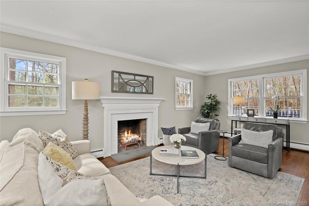 183 Frogtown Road New Canaan, CT 06840 - Photo 4 of 37 a living room with furniture fireplace and window
