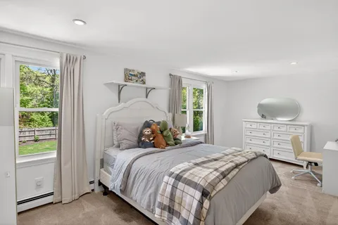 a room with a bed and a window