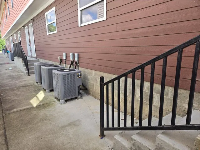 a view of a porch with a hanging chair