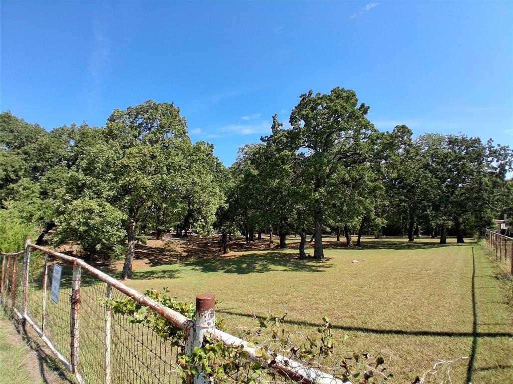 a view of a swimming pool with a yard