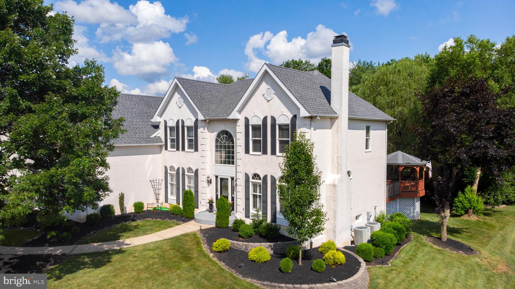 Front Exterior And Wooded Backdrop