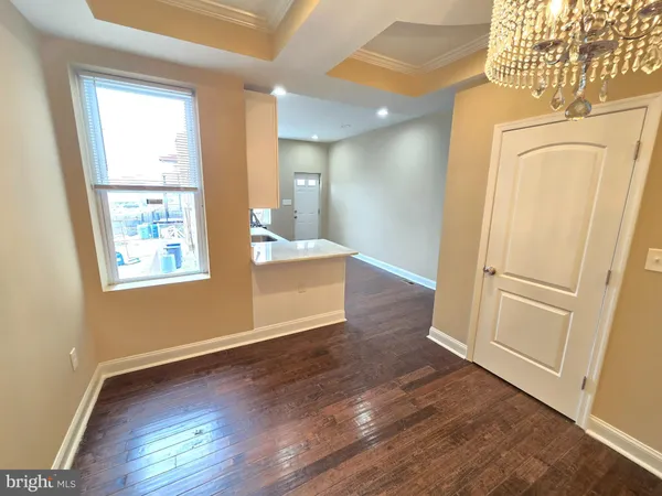 a view of entryway with wooden floor