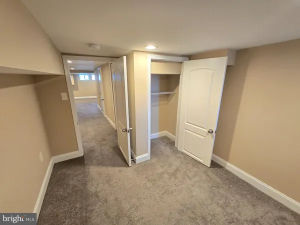 a view of a hallway with windows