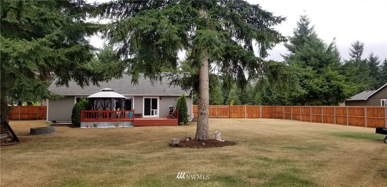 18032 Prairie Pointe Lane Southwest Rochester, WA 98579 - Photo 2 of 2 a front view of a house with a yard