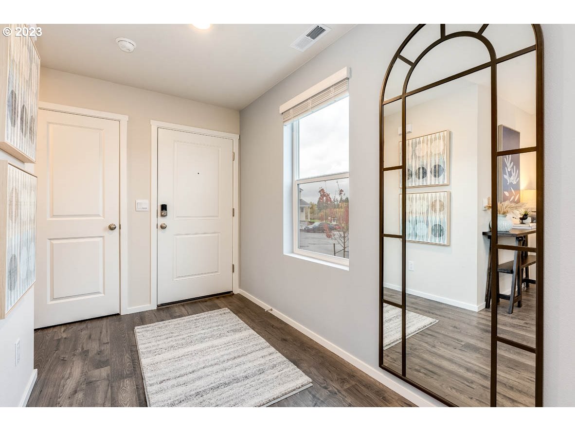 921 Northwest 174th Street Ridgefield, WA 98642 - Photo 3 of 26 a view of an entryway with wooden floor