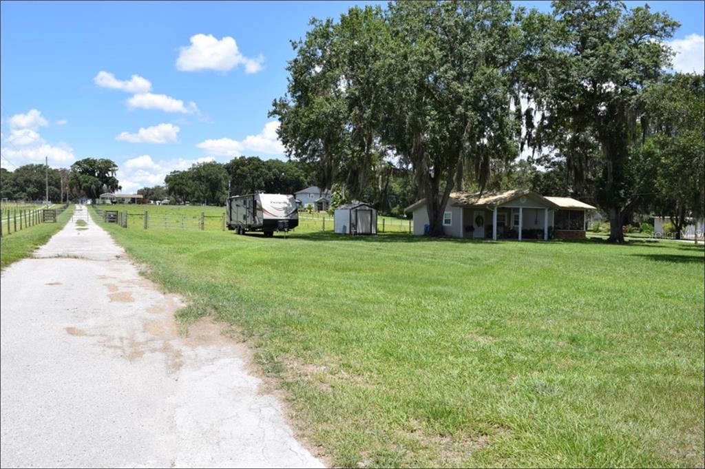 604 North Dover Road Valrico, FL 33594 - Photo 1 of 1 Front View of COTTAGE & MAIN HOUSE in the background