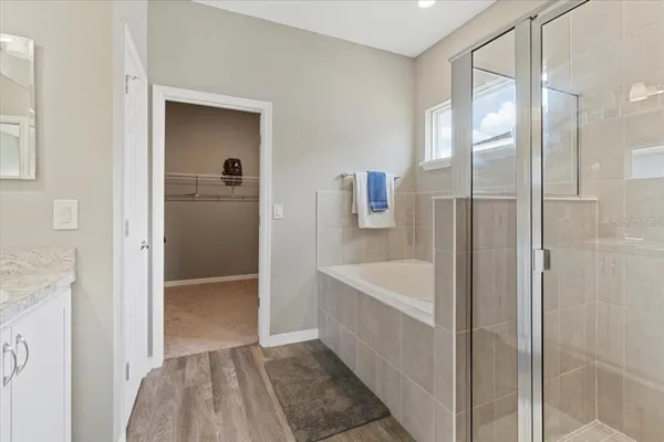 a bathroom with a bathtub and a shower