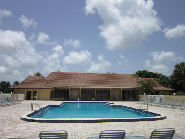 2805 Southwest 22nd Avenue, Unit 2060 Delray Beach, FL 33445 - Photo 11 of 11 a view of a house with pool and a yard