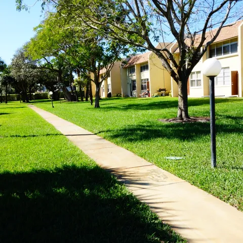 a view of a street with a building in the background