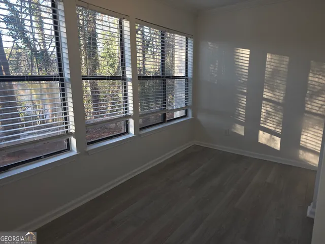 a view of a room with a large window