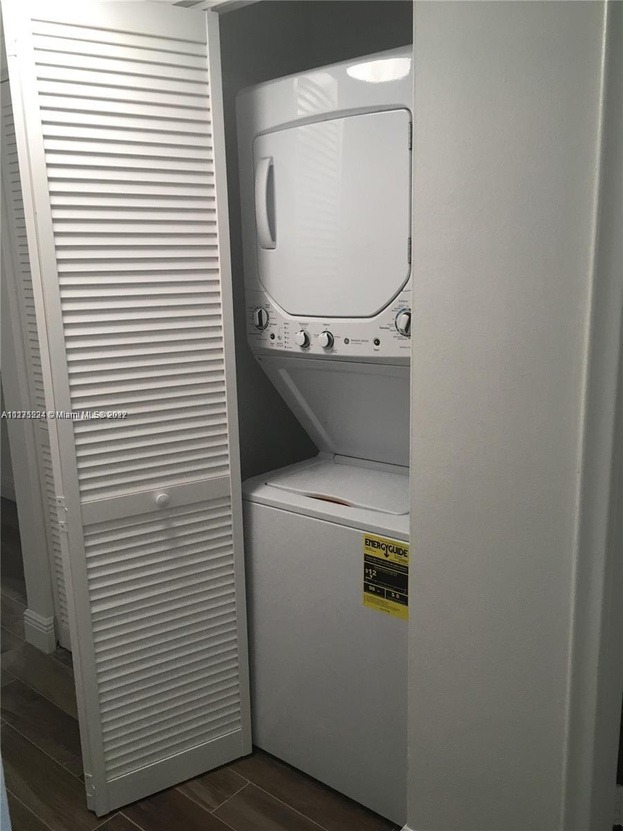 7915 Southwest 86th Street, Unit 723 Miami, FL 33143 - Photo 14 of 14 a utility room with dryer and washer